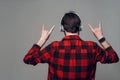 Back View. Man Listening to Music with Headphones Royalty Free Stock Photo