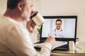 Man making video call with her doctor while staying at home Royalty Free Stock Photo