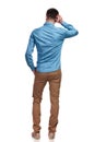 Back view of a man scratching his head and thinking Royalty Free Stock Photo