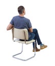 Back view of a man sitting on a chair