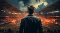 Back view man standing in a soccer stadium Royalty Free Stock Photo