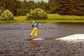 Back view of man wakeboarding on a lake Royalty Free Stock Photo