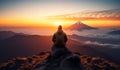 Man wearing mountain jacket sitting on top of the mountain and watching the sunrise in the morning Royalty Free Stock Photo