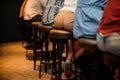 Back view of men sitting on chairs near the bar counter Royalty Free Stock Photo