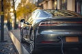 Back view on metallic Electric car charging station on the street.