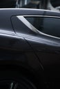 Back view of a modern luxury gray  metallic car, auto detail, car care concept in the garage Royalty Free Stock Photo