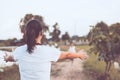 Back view of mother raise hand to wait her child girl Royalty Free Stock Photo