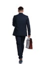 Back view of a motivated businessman holding his briefcase Royalty Free Stock Photo