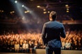 back view of motivational speaker on stage