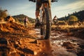 Back view Mountain bikes tire and riders foot on brown dirt path