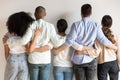 Back view of multiracial friends hug showing unity and support Royalty Free Stock Photo