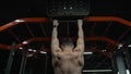 back view of muscular athlete pullup in sport gym. sport athlete with pullup in gym. athlete pullup