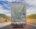 Back view of music truck cargo transport container on the high road Royalty Free Stock Photo