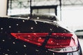 Back view of new black car. Closeup headlights of car. Black premium city crossover, luxury SUV rear light closeup. Car Royalty Free Stock Photo