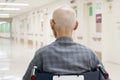 Old man sitting on wheelchair in hospital Royalty Free Stock Photo