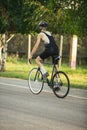 Young male cyclist riding a road bike in summer day. Action, motion concept Royalty Free Stock Photo