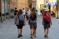 Young tourists walking on a street of Brasov, Romania