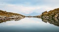 Back view person female stand on edge in nature calm landscape look to sides search purpose in life alone in scenic mountains in