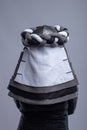 Back View of a Person in Medieval Knight Helmet and Layered Garment Royalty Free Stock Photo