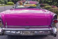 Back view of a pink classic vintage american car in Cuba Royalty Free Stock Photo