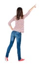 Back view of pointing woman. Royalty Free Stock Photo