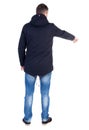 Back view of pointing young man in parka. Royalty Free Stock Photo