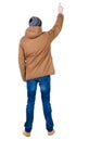 Back view of pointing young men in parka.