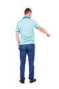 Back view of pointing young men in shirt and jeans. Royalty Free Stock Photo