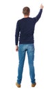 Back view of pointing young men in shirt and jeans. Royalty Free Stock Photo