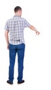 Back view of pointing young men in shirt and jeans. Royalty Free Stock Photo