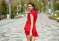 Back view portrait, young slender woman in red dress Royalty Free Stock Photo