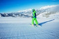 Back view of the preteen boy alpine ski go down fresh skiing Royalty Free Stock Photo