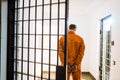 back view of prisoner standing in handcuffs Royalty Free Stock Photo