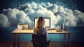 Back view of a programmer girl sitting in clouds working with laptop on the desk