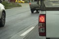 Back view of rear side white pick up car on the road. Royalty Free Stock Photo