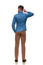 Back view of relaxed casual man scratching his head Royalty Free Stock Photo