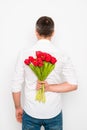 Back view of romantic man holding bouquet of tulips Royalty Free Stock Photo