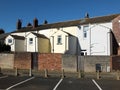 Back view of a row of white and yellow painted typical small english terraced housed in fleetwood lancashire Royalty Free Stock Photo