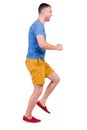 Back view of running man in t-shirt and shorts Royalty Free Stock Photo