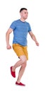 Back view of running man in t-shirt and shorts Royalty Free Stock Photo