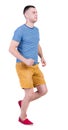 Back view of running man in t-shirt and shorts Royalty Free Stock Photo