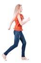 Back view of running woman. Royalty Free Stock Photo