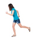 Back view of running woman. Royalty Free Stock Photo