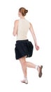 Back view of running woman in dress Royalty Free Stock Photo