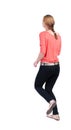 Back view of running woman in jeans Royalty Free Stock Photo