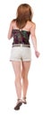 Back view of running woman in shorts Royalty Free Stock Photo