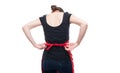 Back view of seller hands tying apron