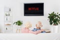 back view of senior couple watching netflix on tv Royalty Free Stock Photo