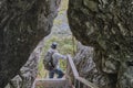 Senior male hiker with backpack, admiring landscape among kissing rocks. Nature park Deer streams Royalty Free Stock Photo