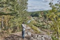 Senior male hiker, exploring route on map of Nature park Deer streams, Russia. Royalty Free Stock Photo